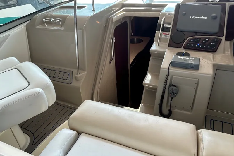 Slide: The Image of Interior cockpit of 2008 Sea Ray Sundancer 330 with Raymarine navigation system. - 21