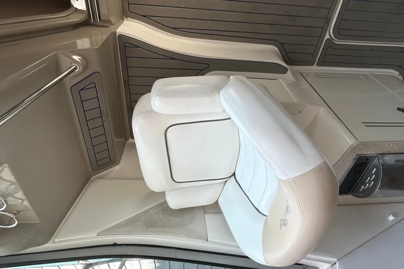 Slide: The Image of 2008 Sea Ray Sundancer 330 interior with white leather seating and sleek design. - 17