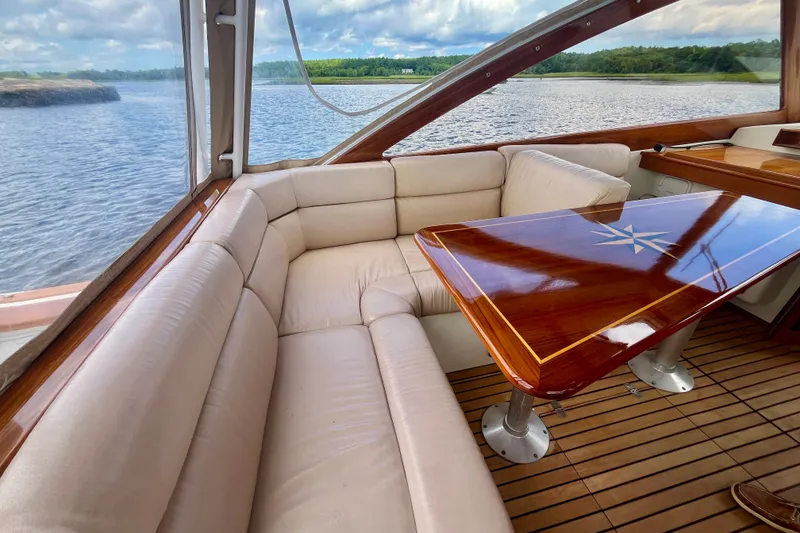 Slide: The Image of Luxurious interior of 2001 Little Harbor Whisper Jet 38 Prop with elegant wood table and plush seating. - 14