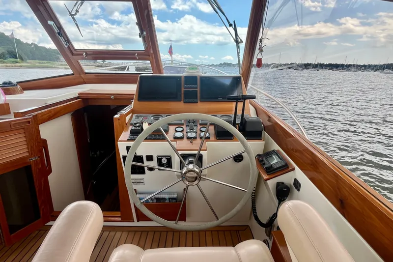 Slide: The Image of Helm of 2001 Little Harbor Whisper Jet 38 Prop with steering wheel and navigation equipment. - 29