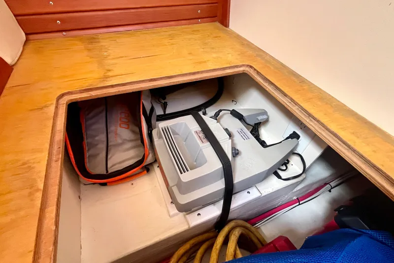 Slide: The Image of Storage compartment in a 2001 Little Harbor Whisper Jet 38 Prop boat. - 46
