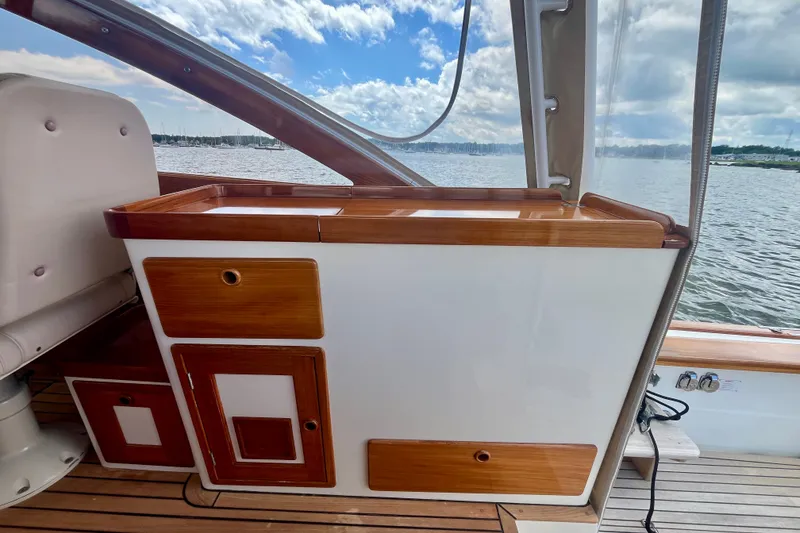Slide: The Image of Interior view of 2001 Little Harbor Whisper Jet 38 Prop, featuring wooden cabinetry and scenic water backdrop. - 31