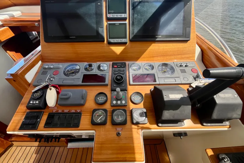 Slide: The Image of Control panel of a 2001 Little Harbor Whisper Jet 38 Prop boat with navigation screens. - 30