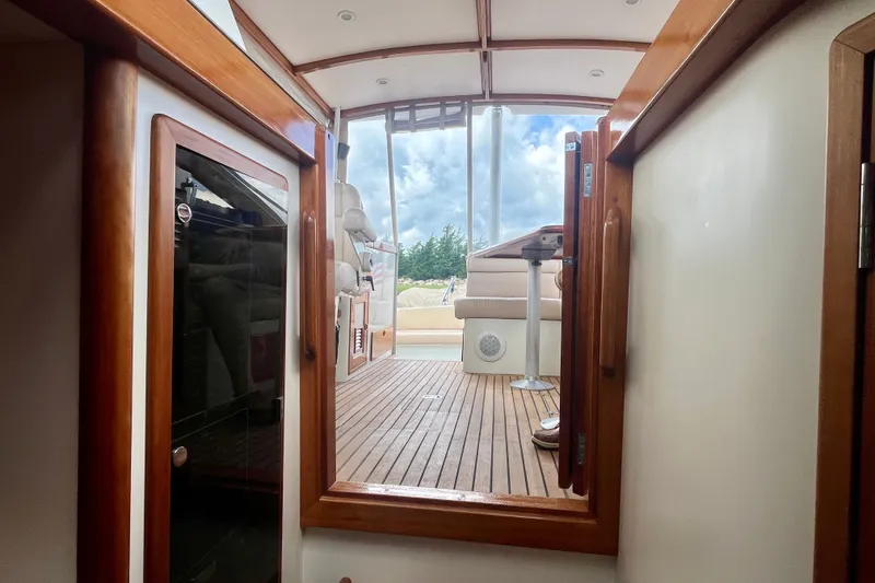 Slide: The Image of Interior view of 2001 Little Harbor Whisper Jet 38 Prop with wooden accents and seating area. - 27