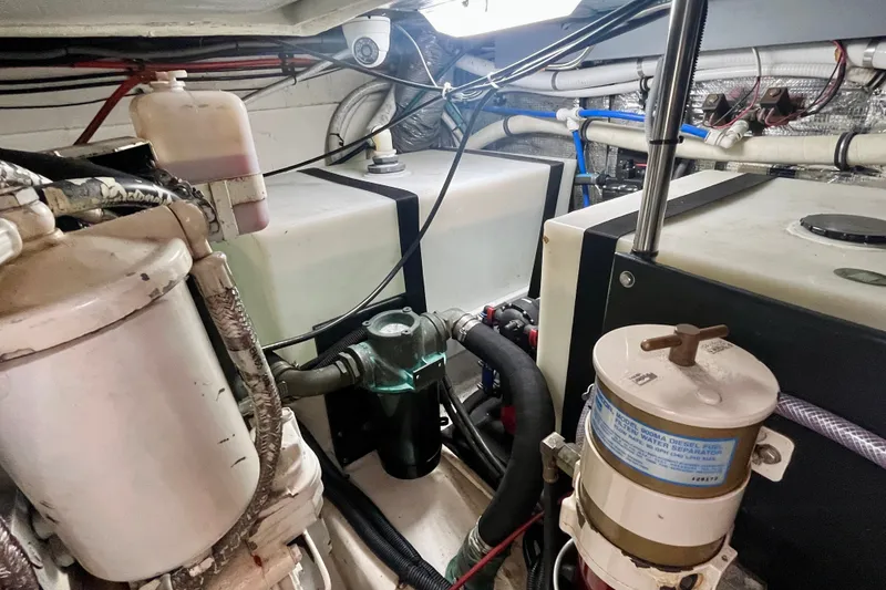 Slide: The Image of Engine room of 2001 Little Harbor Whisper Jet 38 Prop with fuel and water systems. - 43