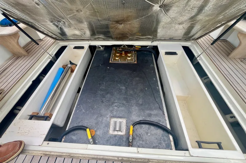 Slide: The Image of Open engine compartment of 2001 Little Harbor Whisper Jet 38 Prop boat. - 40