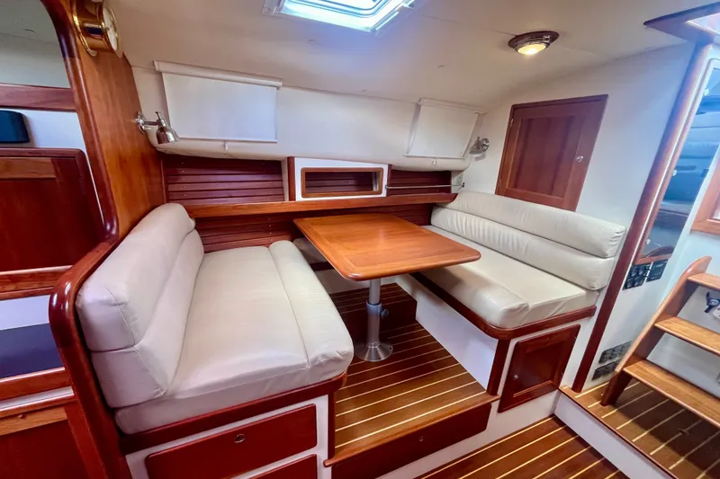 Slide: The Image of Interior of 2001 Little Harbor Whisper Jet 38 Prop with cozy seating and wooden finishes. - 23