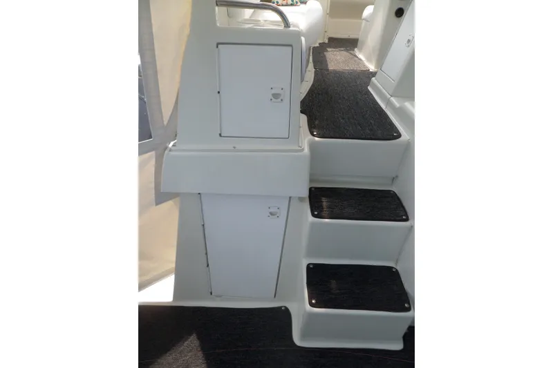 Slide: The Image of Interior stairs of 1994 Silverton 34 Aft Cabin Motor Yacht with storage compartments. - 17