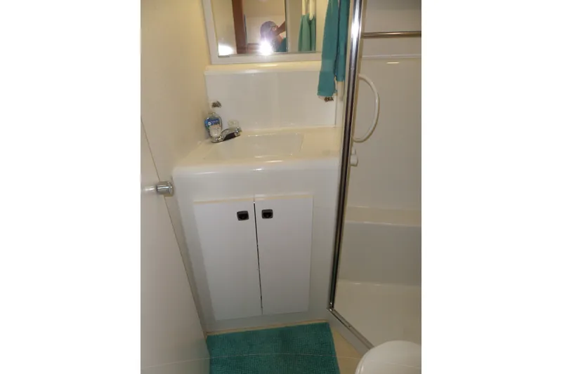 Slide: The Image of Bathroom interior of 1994 Silverton 34 Aft Cabin Motor Yacht with sink and shower. - 44