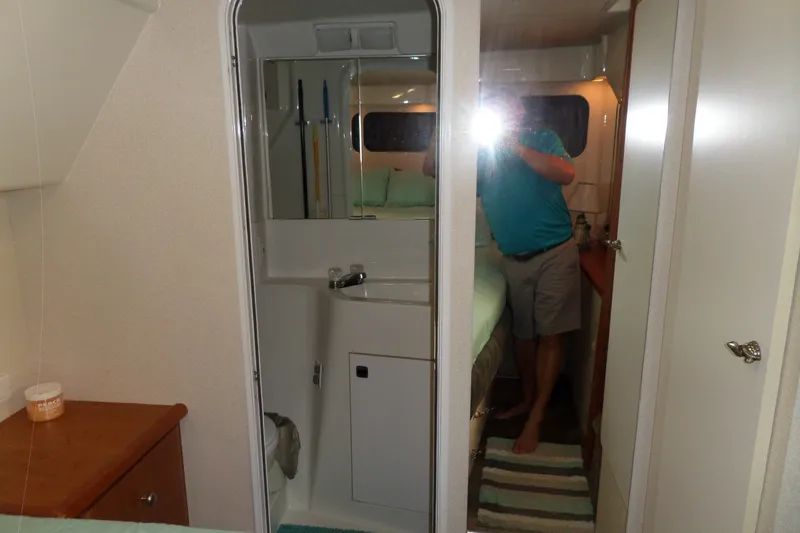Slide: The Image of Interior of 1994 Silverton 34 Aft Cabin Motor Yacht with bathroom and bedroom view. - 62