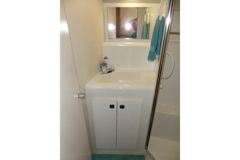Slide: The Image of Bathroom sink area in 1994 Silverton 34 Aft Cabin Motor Yacht. - 43