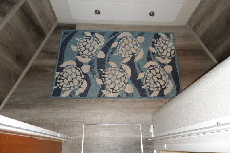 Slide: The Image of Interior of 1994 Silverton 34 Aft Cabin Motor Yacht with turtle-patterned rug. - 54