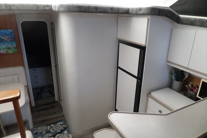 Slide: The Image of Interior of 1994 Silverton 34 Aft Cabin Motor Yacht with modern kitchen amenities. - 31