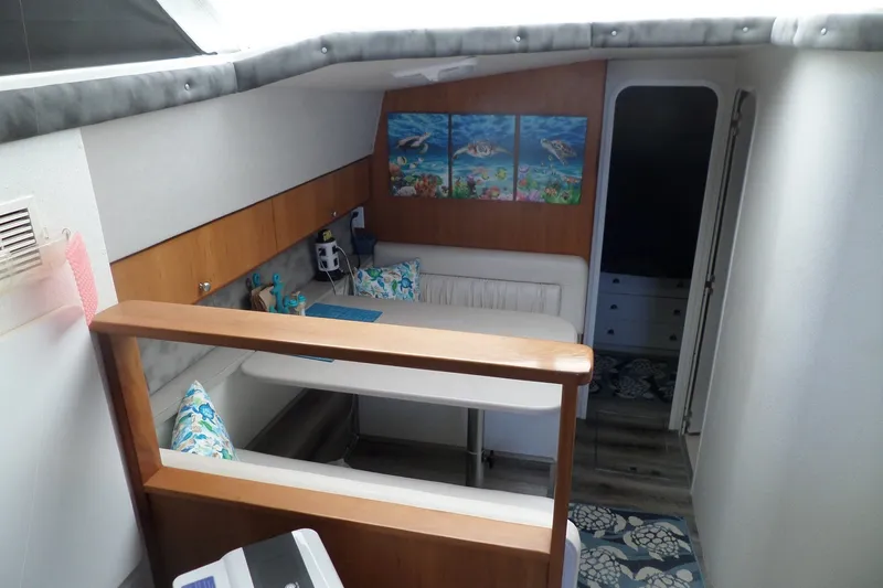 Slide: The Image of Interior of 1994 Silverton 34 Aft Cabin Motor Yacht with cozy seating and marine decor. - 30