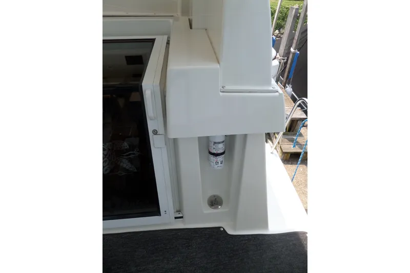 Slide: The Image of 1994 Silverton 34 Aft Cabin Motor Yacht deck detail with window and equipment. - 22