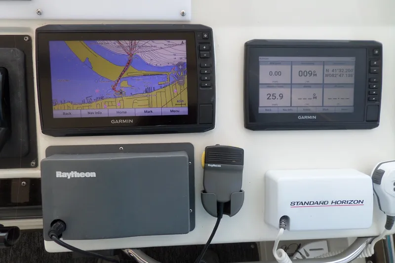 Slide: The Image of Navigation equipment on a 1994 Silverton 34 Aft Cabin Motor Yacht dashboard. - 3