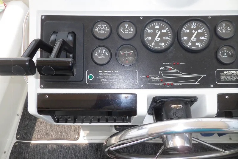 Slide: The Image of 1994 Silverton 34 Aft Cabin Motor Yacht dashboard with gauges and controls. - 7