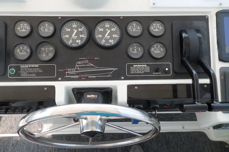 Slide: The Image of 1994 Silverton 34 Aft Cabin Motor Yacht dashboard with gauges and controls. - 8