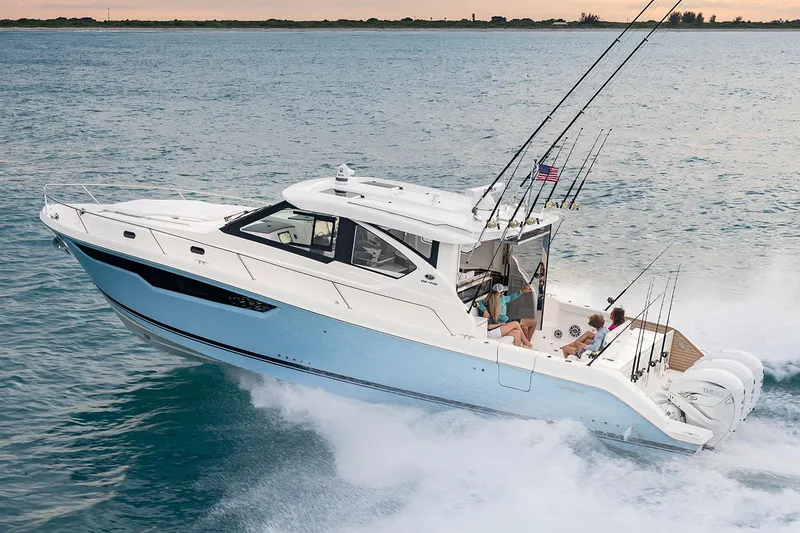 Slide: The Image of Manufacturer Provided Image: 2024 Pursuit OS 445 Offshore boat cruising on the water. - 69