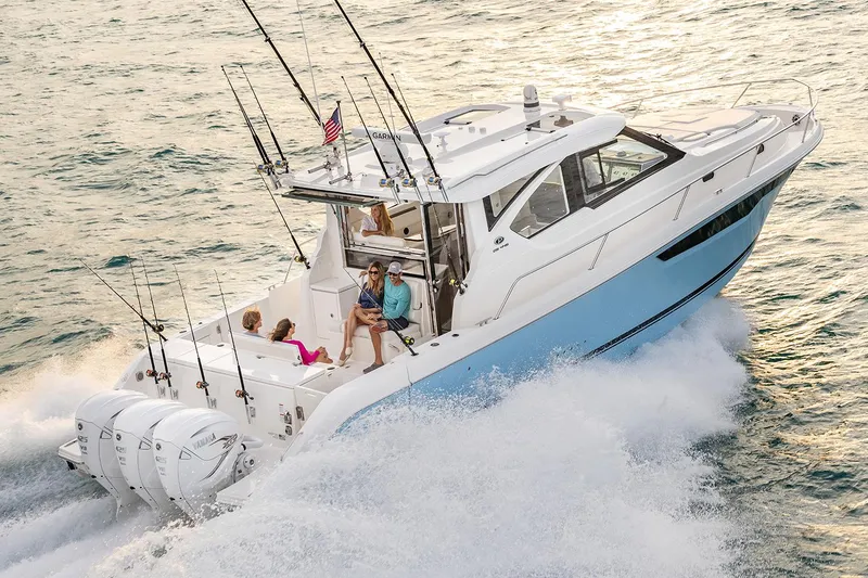 Slide: The Image of Manufacturer Provided Image: 2024 Pursuit OS 445 Offshore boat cruising with family on board. - 71