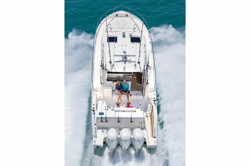 Slide: The Image of Manufacturer Provided Image: 2024 Pursuit OS 445 Offshore boat cruising on water, aerial view. - 72