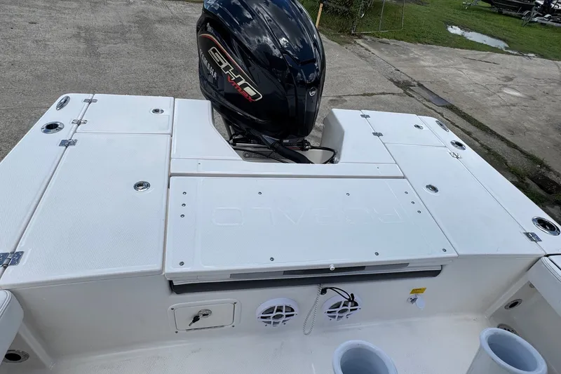 Slide: The Image of 2026 Robalo 226 Cayman boat with Yamaha engine, featuring spacious deck and storage compartments. - 16