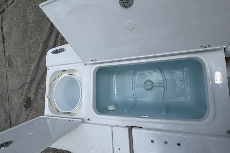 Slide: The Image of Livewell and storage compartments on 2026 Robalo 226 Cayman boat. - 19
