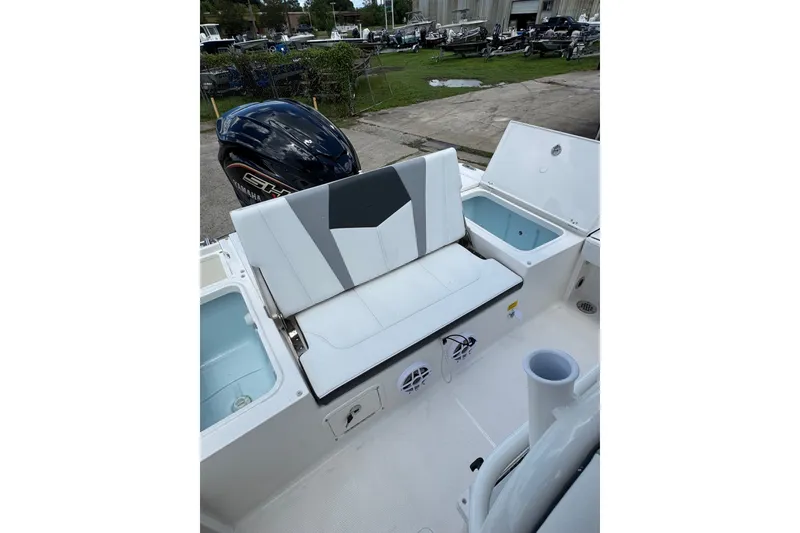 Slide: The Image of 2026 Robalo 226 Cayman boat interior with seating and storage compartments. - 18
