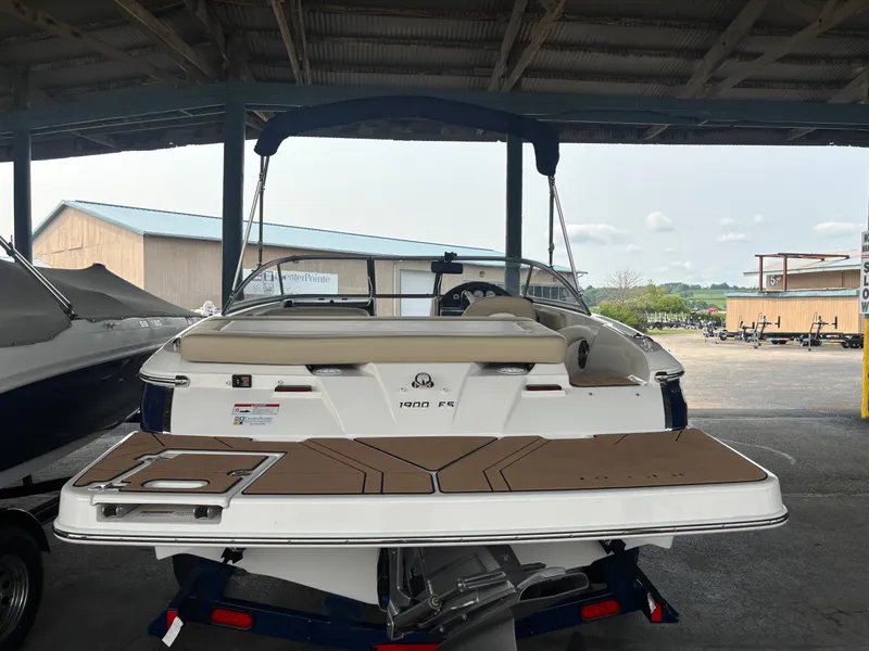 Slide: The Image of A 2017 Regal 1900 ES Bowrider on a trailer in a covered area. - 6