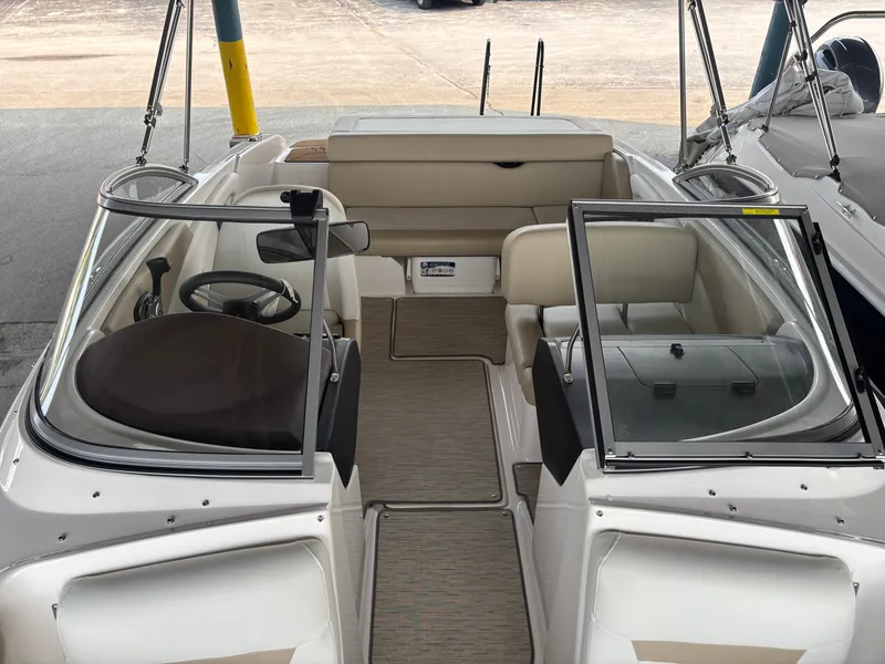 Slide: The Image of The image shows the cockpit of a 2017 Regal 1900 ES Bowrider with beige seating. - 14