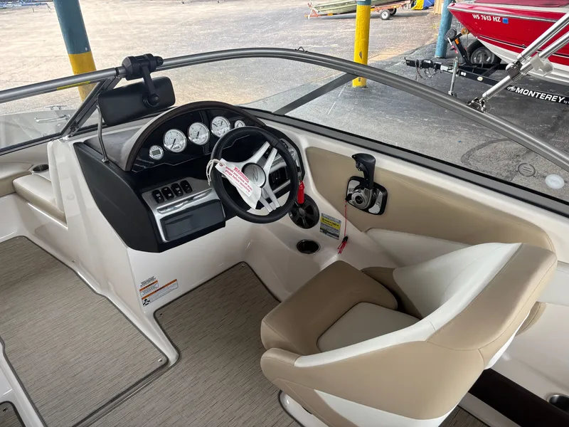 Slide: The Image of The image shows the cockpit of a 2017 Regal 1900 ES Bowrider with a modern helm. - 10