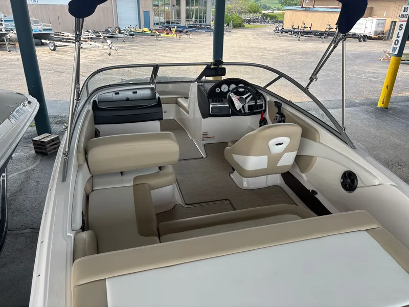 Slide: The Image of The image shows a 2017 Regal 1900 ES Bowrider with beige seating and a modern cockpit. - 8