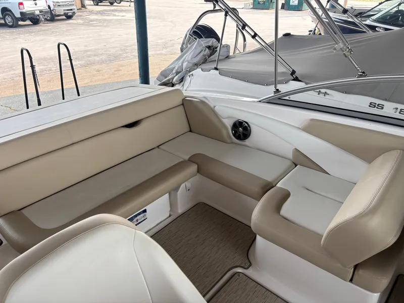 Slide: The Image of Interior view of a 2017 Regal 1900 ES Bowrider with beige upholstery and a speaker. - 15