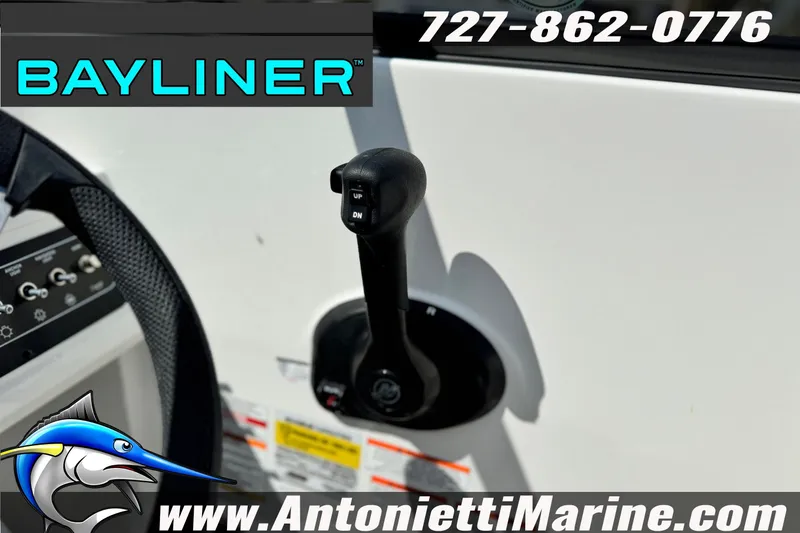 Slide: The Image of 2026 Bayliner D22 boat control panel with throttle lever, featuring branding and contact details. - 16