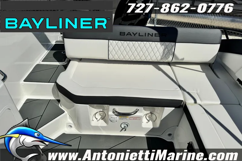 Slide: The Image of 2026 Bayliner D22 boat interior with white seating, featuring Bayliner branding and contact information. - 28