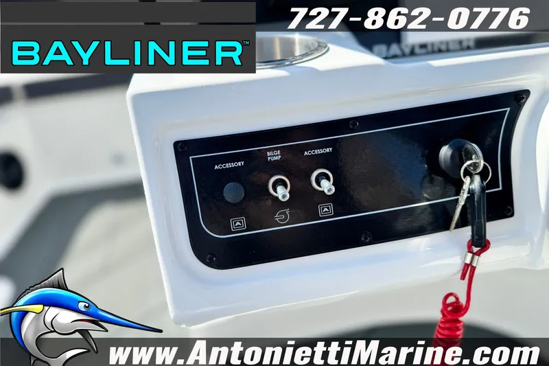 Slide: The Image of Control panel of 2026 Bayliner D22 boat with switches and key. - 14