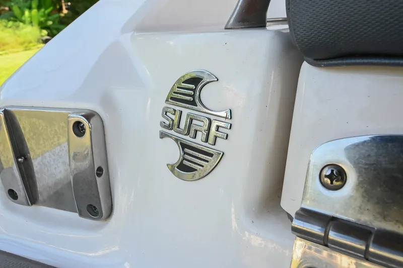 Slide: The Image of 2019 Chaparral Vortex 2430 VRX boat with "Surf" emblem detail. - 10