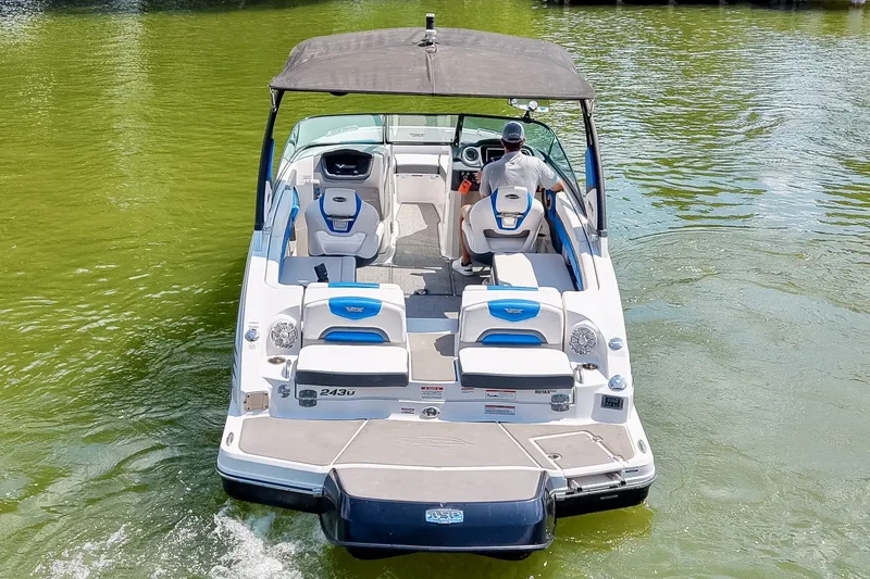 Slide: The Image of 2019 Chaparral 203 Vortex boat cruising on a calm green lake. - 6