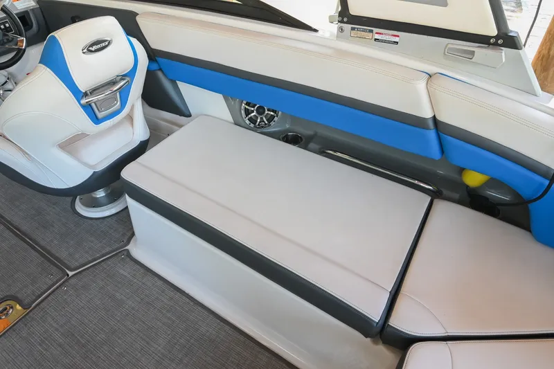 Slide: The Image of 2019 Chaparral Vortex 2430 VRX boat interior with blue and white seating. - 22