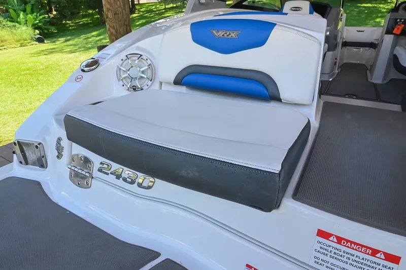 Slide: The Image of 2019 Chaparral Vortex 2430 VRX boat interior with seating and speaker detail. - 16