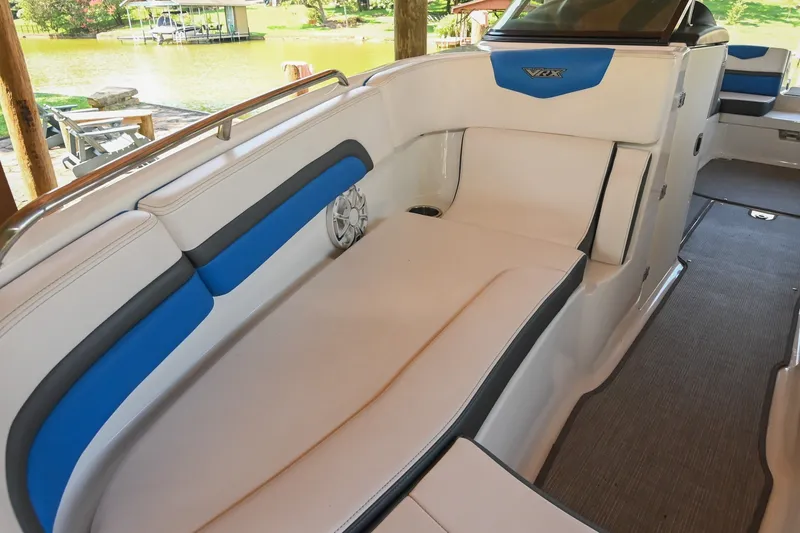 Slide: The Image of 2019 Chaparral Vortex 2430 VRX boat interior with white and blue seating. - 44