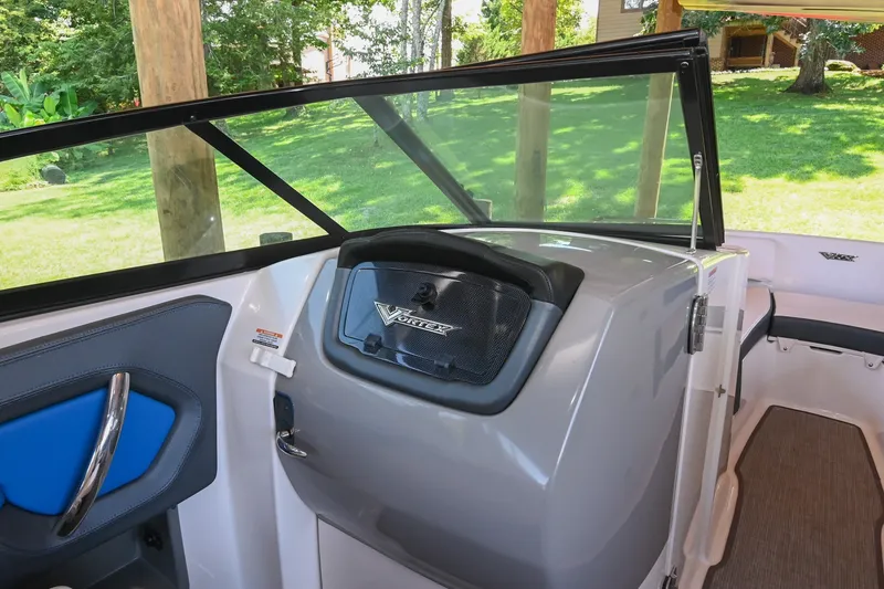 Slide: The Image of 2019 Chaparral Vortex 2430 VRX boat interior with windshield and seating area. - 31