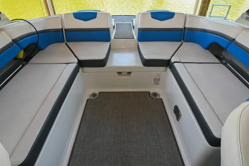 Slide: The Image of Interior seating of 2019 Chaparral Vortex 2430 VRX boat with blue and gray upholstery. - 21