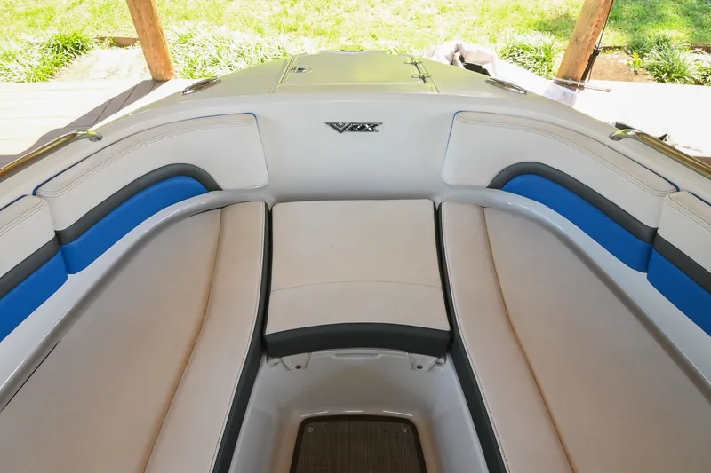 Slide: The Image of 2019 Chaparral Vortex 2430 VRX boat interior with cushioned seating and sleek design. - 46
