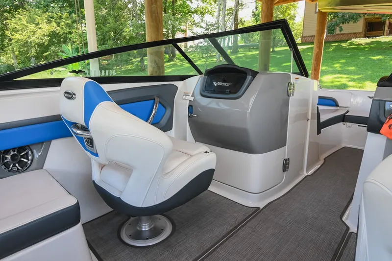 Slide: The Image of 2019 Chaparral Vortex 2430 VRX boat interior with modern seating and dashboard. - 29