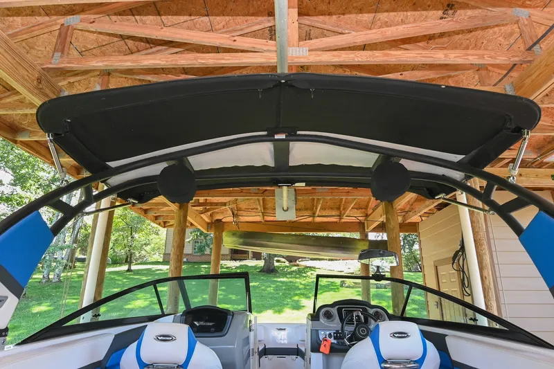 Slide: The Image of 2019 Chaparral Vortex 2430 VRX boat under wooden shelter, interior view. - 20