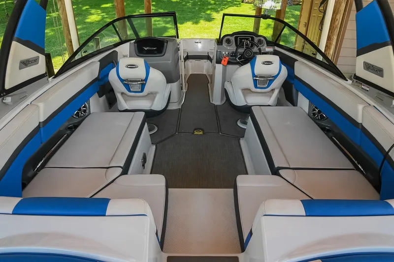 Slide: The Image of 2019 Chaparral Vortex 2430 VRX boat interior with blue and white seating. - 19