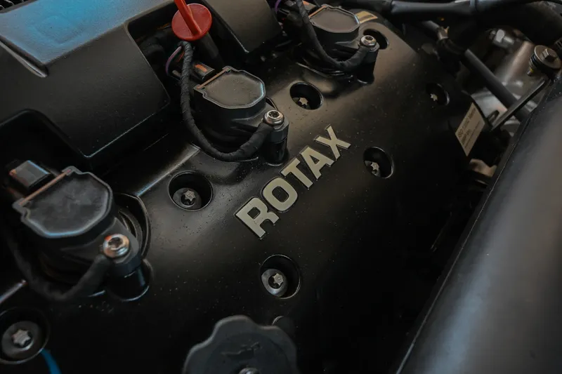 Slide: The Image of Close-up of a Rotax engine in a 2019 Chaparral Vortex 2430 VRX boat. - 50