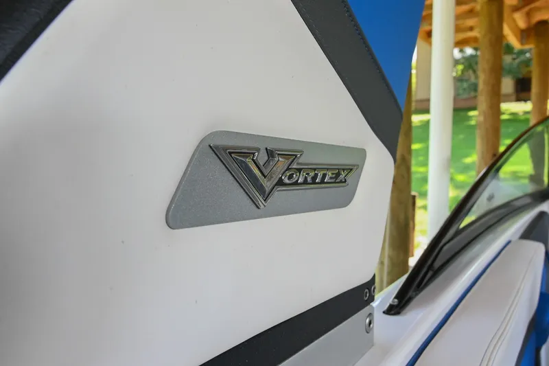 Slide: The Image of 2019 Chaparral Vortex 2430 VRX boat emblem detail in a scenic setting. - 8