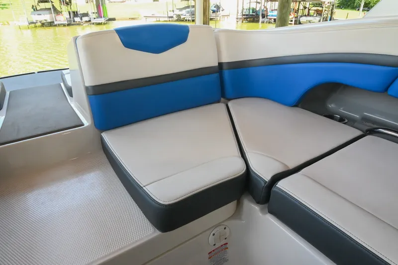 Slide: The Image of 2019 Chaparral Vortex 2430 VRX boat interior seating with blue and gray accents. - 25